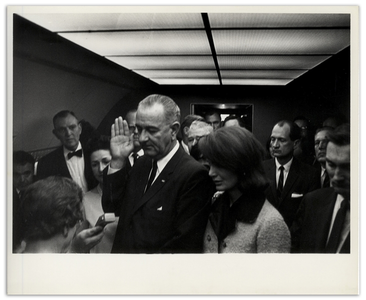 Cecil W. Stoughton's Personal, Unpublished 10'' x 8'' Photo of LBJ's Inauguration Aboard Air Force One -- LBJ Takes the Oath of Office as Jackie Stands Witness